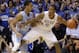 Duke's Rodney Hood (5) is pressured by North Carolina's J.P. Tokoto (13) during the first half of an NCAA college basketball game in Durham, N.C., Saturday, March 8, 2014. (AP Photo/Gerry Broome)