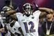 Baltimore Ravens wide receiver Jacoby Jones runs onto the field before the NFL Super Bowl XLVII football game against the San Francisco 49ers Sunday, Feb. 3, 2013, in New Orleans. (AP Photo/Julio Cortez)