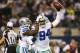 ARLINGTON, TX - DECEMBER 29: DeMarcus Ware #94 and Morris Claiborne #24 of the Dallas Cowboys celebrate in the second half against the Philadelphia Eagles at Cowboys Stadium on December 29, 2013 in Arlington, Texas. (Photo by Ronald Martinez/Getty Images)
