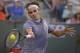 Roger Federer, of Switzerland, returns a shot against Tommy Haas, of Germany, during a match at the BNP Paribas Open tennis tournament, Wednesday, March 12, 2014, in Indian Wells, Calif. (AP Photo/Mark J. Terrill)