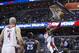 Washington Wizards guard John Wall (2) scores during the second half of an NBA basketball game against the Charlotte Bobcats on Wednesday, March 12, 2014, in Washington. The Bobcats defeated the Wizards 98-85. (AP Photo/ Evan Vucci)