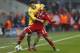 Arsenal's Mesut Ozil, left, and Bayern's Thiago Alcantara challenge for the ball during the Champions League round of 16 second leg soccer match between FC Bayern Munich and FC Arsenal in Munich, Germany, Wednesday, March 12, 2014. (AP Photo/Matthias Schrader)