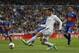 Real's Isco, centre right, Elche's Aaron Niguez, centre left, during a Spanish La Liga soccer match between Real Madrid and Elche at the Santiago Bernabeu stadium in Madrid, Spain, Saturday, Feb. 22, 2014. (AP Photo/Andres Kudacki)