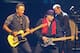 American performer Bruce Springsteen, left, plays with band member Steven Van Zandt, right, during his live performance in Cape Town, South Africa, Sunday, Jan. 26, 2014. (AP Photo/Schalk van Zuydam)