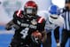 San Diego State running back Adam Muema (4) runs the ball past Buffalo linebacker Khalil Mack during the first half of the Famous Idaho Potato Bowl NCAA college football game in Boise, Idaho, on Saturday, Dec. 21, 2013. San Diego State won 49-24. (AP Photo/Otto Kitsinger)