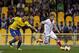 Sevilla's Marko Marin, from Germany, sidesteps Estoril's Bruno Miguel, left, during their Europa League group H soccer match at the António Coimbra da Mota stadium in Estoril, near Lisbon, Thursday, Sept. 19, 2013. (AP Photo/Francisco Seco)