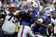 Buffalo Bills quarterback EJ Manuel (3) scrambles away from New England Patriots' Vince Wilfork (75) during the first half of an NFL football game Sunday, Sept. 8, 2013, in Orchard Park. (AP Photo/Gary Wiepert)