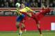 Sweden's Kim Kallstrom, left, and Portugal's Joao Moutinho challenge for the ball during the World Cup qualifying playoff second leg soccer match between Sweden and Portugal in Stockholm, Sweden, Tuesday, Nov.19, 2013. (AP Photo/Frank Augstein)