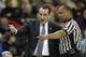 Duke head coach Mike Krzyzewski, left, argues a call with a referee during the first half of an NCAA college basketball game against Wake Forest in Winston-Salem, N.C., Wednesday, March 5, 2014. (AP Photo/Chuck Burton)