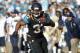 Dec 22, 2013; Jacksonville, FL, USA; Jacksonville Jaguars running back Maurice Jones-Drew (32) runs with the ball as Tennessee Titans defends during the second half at EverBank Field. Tennessee Titans defeated the Jacksonville Jaguars 20-16. Mandatory Credit: Kim Klement-USA TODAY Sports