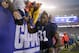 New York Giants' Justin Tuck (91) greets fans as he leaves the field after an NFL football game against the Washington Redskins, Sunday, Dec. 29, 2013, in East Rutherford, N.J. The Giants won the game 20-6. (AP Photo/Peter Morgan)