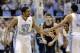 North Carolina's James Michael McAdoo (43) and Marcus Paige (5) react following a play against Notre Dame during the second half of an NCAA college basketball game in Chapel Hill, N.C., Monday, March 3, 2014. North Carolina won 63-61. (AP Photo/Gerry Broome)