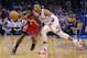 Houston Rockets guard Pat Beverley (2) drives around Oklahoma City Thunder guard Russell Westbrook (0) during the first quarter of an NBA basketball game in Oklahoma City, Tuesday, March 11, 2014. (AP Photo/Sue Ogrocki)