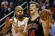 Chicago Bulls' Mike Dunleavy (34) drives past Phoenix Suns' P.J. Tucker during the first half of an NBA basketball game, Tuesday, Feb. 4, 2014, in Phoenix. (AP Photo/Matt York)