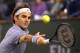 Roger Federer, of Switzerland, reaches for a backhand return to Kevin Anderson, of South Africa, during the quarterfinals of the BNP Paribas Open tennis tournament, Thursday, March 13, 2014, in Indian Wells, Calif. (AP Photo/Mark J. Terrill)
