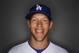 Los Angeles Dodgers pitcher Clayton Kershaw tosses a baseball during photo day Feb. 20, 2014 in Glendale, Ariz. (AP Photo/Paul Sancya)