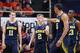 CHAMPAIGN, IL - MARCH 4: Spike Albrecht #2, Jon Horford #15, Nik Stauskas #11 and Caris LeVert #23 of the Michigan Wolverines celebrate during the game against the Illinois Fighting Illini at State Farm Center on March 4, 2014 in Champaign, Illinois. Michigan defeated Illinois 84-53. (Photo by Joe Robbins/Getty Images)