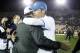 UCLA head coach Jim Mora hugs Washington head coach Steve Sarkisian after UCLA defeated Washington 41-31 in their NCAA college football game Friday, Nov. 15, 2013, in Pasadena, Calif. (AP Photo/Alex Gallardo)