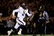 COLUMBIA, MO - NOVEMBER 30: Quarterback Johnny Manziel #2 of the Texas A&M Aggies scrambles as defensive lineman Harold Brantley #90 of the Missouri Tigers chases during the game on November 30, 2013 in Columbia, Missouri. (Photo by Jamie Squire/Getty Images)