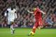 Liverpool's Luis Suarez keeps the ball from Swansea City's Nathan Dyer during their English Premier League soccer match at Anfield Stadium, Liverpool, England, Sunday Feb. 23, 2014. (AP Photo/Jon Super)