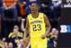 INDIANAPOLIS, IN - MARCH 14: Caris LeVert #23 of the Michigan Wolverines celebrates in the game against the Illinois Fighting Illini during the Quarterfinals of the Big Ten Basketball Tournament at Bankers Life Fieldhouse on March 14, 2014 in Indianapolis, Indiana. (Photo by Andy Lyons/Getty Images)