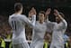 Real Madrid's Gareth Bale from Great Britain, left, celebrates his goal with Real Madrid's Pepe, centre, and Real Madrid's Daniel Carvajal, right during a Spanish La Liga soccer match between Real Madrid and Villarreal at the Bernabeu stadium stadium in Madrid, Spain, Saturday, Feb. 8, 2014. (AP Photo/Andres Kudacki)