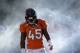 Denver Broncos cornerback Dominique Rodgers-Cromartie (45) walks onto the field before playing against the San Diego Chargers in an NFL AFC division playoff football game, Sunday, Jan. 12, 2014, in Denver. (AP Photo/Charlie Riedel)