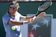 INDIAN WELLS, CA - MARCH 10: Roger Federer of Switzerland hits a return to Dmitry Tursunov of Russia during the BNP Paribas Open at Indian Wells Tennis Garden on March 9, 2014 in Indian Wells, California. Federer won 7-6 (7), 7-6 (2). (Photo by Stephen Dunn/Getty Images). (Photo by Stephen Dunn/Getty Images)