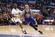 Golden State Warriors' Stephen Curry dribbles the ball around Los Angeles Clippers' Chris Paul during the first half of an NBA basketball game in Los Angeles, Wednesday, March 12, 2014. (AP Photo/Danny Moloshok)