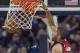 Portland Trail Blazers forward Nicolas Batum (88) dunks against against the New Orleans Pelicans in the second half of an NBA basketball game in New Orleans, Friday, March 14, 2014. The Trail Blazers won 111-103. (AP Photo/Scott Threlkeld)