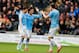 HULL, ENGLAND - MARCH 15: Edin Dzeko (R) of Manchester City celerates with teammates Jesus Navas (L) and David Silva (C) after scoring his team's second goal during the Barclays Premier league match between Hull City and Manchester City at KC Stadium on March 15, 2014 in Hull, England. (Photo by Paul Thomas/Getty Images)