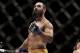 Johny Hendricks walks to his corner during a UFC 167 mixed martial arts championship welterweight bout against Georges St. Pierre, of Canada, on Saturday, Nov. 16, 2013, in Las Vegas. St. Pierre won by split decision. (AP Photo/Isaac Brekken)