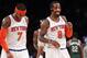 Mar 15, 2014; New York, NY, USA; New York Knicks forward Carmelo Anthony (7) and guard J.R. Smith (8) react during the game against the Milwaukee Bucks at Madison Square Garden. Mandatory Credit: Noah K. Murray-USA TODAY Sports