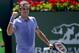Roger Federer, of Switzerland, celebrates his win against Alexandr Dolgopolov, of Ukraine, during their semifinal match at the BNP Paribas Open tennis tournament, Saturday, March 15, 2014, in Indian Wells, Calif. (AP Photo/Mark J. Terrill)
