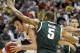 Wisconsin forward Frank Kaminsky drives the ball against Michigan State forward Adreian Payne (5) in the first half of an NCAA college basketball game in the semifinals of the Big Ten Conference tournament Saturday, March 15, 2014, in Indianapolis. (AP Photo/Kiichiro Sato)