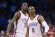 Oklahoma City Thunder guard Russell Westbrook (0) reacts following a three point basket in the second quarter of an NBA basketball game against the Philadelphia 76ers in Oklahoma City, Tuesday, March 4, 2014. Thunder forward Kevin Durant (35) is at left. (AP Photo/Sue Ogrocki)
