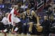 Washington Wizards guard John Wall, left, defends Brooklyn Nets guard Deron Williams during the first half of an NBA basketball game on Saturday, March 15, 2014, in Washington. (AP Photo/ Evan Vucci)