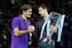 Novak Djokovic, right, of Serbia holds the winners ATP World Tour tennis trophy as he shakes hands with runner-up Roger Federer of Switzerland during the presentation ceremony following their singles final match in London, Monday, Nov. 12, 2012. (AP Photo/Sang Tan)