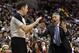 Philadelphia 76ers head coach Brett Brown, right, yells for a timeout to referee Brent Barnaky during the second half of an NBA basketball game against the Indiana Pacers, Friday, March 14, 2014, in Philadelphia. Indiana won 101-94. (AP Photo/Matt Slocum)