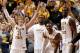 Mar 9, 2014; St. Louis, MO, USA; Wichita State Shockers guard Ron Baker (31) celebrates with teammates as the final buzzer sounds and the Wichita State Shockers defeat the Indiana State Sycamores to win the Missouri Valley Conference basketball tournament at Scotttrade Center.Wichita won 83-69. Mandatory Credit: Scott Kane-USA TODAY Sports
