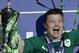 Ireland's Brian O'Driscoll, celebrates after defeating France and winning the Six Nations Rugby Union tournament at the stade de France stadium, in Saint Denis, outside Paris, Saturday, March 15, 2014. (AP Photo/Christophe Ena)