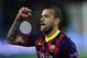 Barcelona's Daniel Alves celebrates at the end of their Champions League, round of 16, second leg, soccer match between FC Barcelona and Manchester City at the Camp Nou Stadium in Barcelona, Spain, Wednesday March 12, 2014. Alves scored the second goal in Barcelona's 2-1 win. (AP Photo/Manu Fernandez)