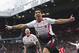 Liverpool's Luis Suarez celebrates after scoring against Manchester United, during their English Premier League soccer match at Old Trafford Stadium, Manchester, England, Sunday, March 16, 2014. (AP Photo/Jon Super)