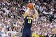 Jan 25, 2014; East Lansing, MI, USA; Michigan Wolverines guard Nik Stauskas (11) attempts to shoot a three point basket against the Michigan State Spartans during the 1st half of a game at Jack Breslin Student Events Center. Mandatory Credit: Mike Carter-USA TODAY Sports