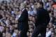 Tottenham Hotspur's manager Tim Sherwood, right, watches his players as Arsenal's manager Arsene Wenger looks on during the English Premier League soccer match between Tottenham Hotspur and Arsenal at White Hart Lane stadium in London, Sunday, March 16, 2014. (AP Photo/Matt Dunham)