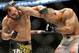 Johny Hendricks, left, and Robbie Lawler exchange punches during a UFC 171 mixed martial arts welterweight title bout, Saturday, March 15, 2014, in Dallas. Hendricks won by decision. (AP Photo/Matt Strasen)