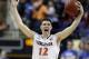 Virginia's Joe Harris (12) celebrates after defeating Duke in an NCAA college basketball game in the championship of the Atlantic Coast Conference tournament in Greensboro, N.C., Sunday, March 16, 2014. Virginia won 72-63. (AP Photo/Bob Leverone)