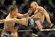 Myles Jury lands a punch on Diego Sanchez during a UFC 171 mixed martial arts lightweight bout, Saturday, March. 15, 2014, in Dallas. Jury won by decision. (AP Photo/Matt Strasen)
