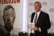 Former Manchester United manager Sir Alex Ferguson poses with his book 'My Autobiography' during a press conference in central London, Tuesday, Oct. 22, 2013. (AP Photo/Sang Tan)