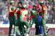 Bangladesh's bowler Shakib Al Hasan, second from left, celebrates with teammates the dismissal of Afghanistan's batsman Najibullah Taraki during their ICC Twenty20 Cricket World Cup opening match in Dhaka, Bangladesh, Sunday, March 16, 2014. (AP Photo/Aijaz Rahi)